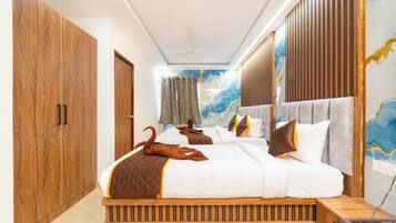 Premium bedding, down duvets, memory-foam beds, laptop workspace