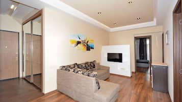 Family Apartment | Living area | 50-inch flat-screen TV with cable channels
