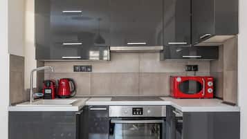 Apartment, Balcony, City View | Private kitchen | Espresso maker, electric kettle