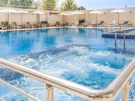 Outdoor pool, pool umbrellas, sun loungers