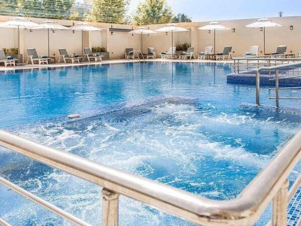 Outdoor pool, pool umbrellas, pool loungers