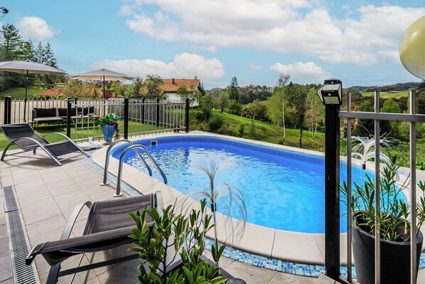 Seasonal outdoor pool, a heated pool