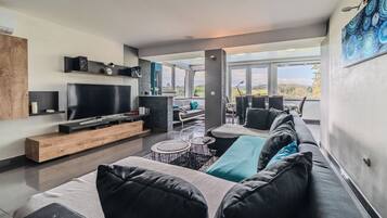 Family House, 2 Bedrooms, 2 Bathrooms, Mountainside (Riverside House with Pool and Hot Tub) | Living area | 21-inch flat-screen TV with satellite channels