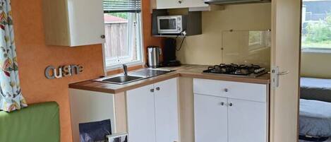 Fridge, stovetop, coffee/tea maker, cookware/dishes/utensils