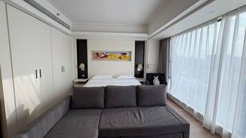 Panoramic Studio Suite | Living area | 50-inch LCD TV with digital channels, pay movies, heated floors