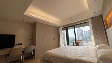 Superior Studio Suite, Balcony, City View | Individually decorated, desk, laptop workspace, blackout curtains