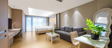 Deluxe King Room (with Balcony View) | Individually decorated, desk, laptop workspace, blackout drapes