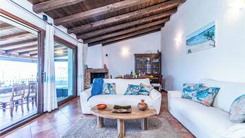 Family Villa, 4 Bedrooms, Mountainside (Villa La Licciola) | Living area | 21-inch Smart TV with cable channels, fireplace, DVD player