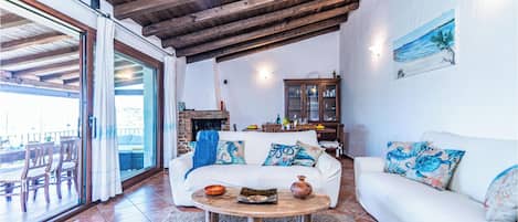 Family Villa, 4 Bedrooms, Mountainside (Villa La Licciola) | Living area | 21-inch Smart TV with cable channels, fireplace, DVD player