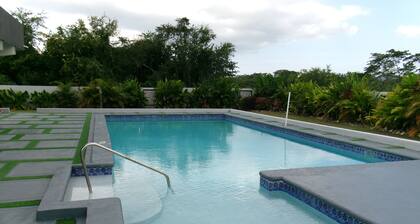 Charming 2-bedroom house in with AC, Pool, hot water, washer and dryer, gated.