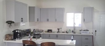Charming 2-bedroom house in with AC, Pool, hot water, washer and dryer, gated.
