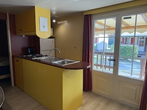 Fridge, microwave, electric kettle, cookware/dishes/utensils