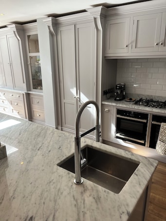 Fridge, microwave, oven, stovetop. Renovated 3 bedroom 2.5 bath family home with large kitchen diner, in Malahide