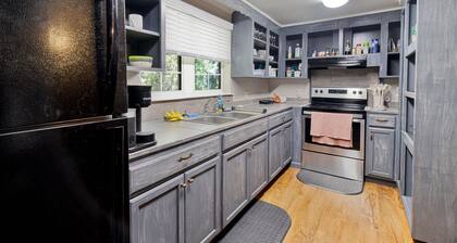 Downtown three bedroom house with game room and outside lounging area.