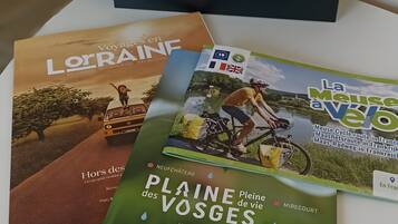 A table with brochures and a folder.