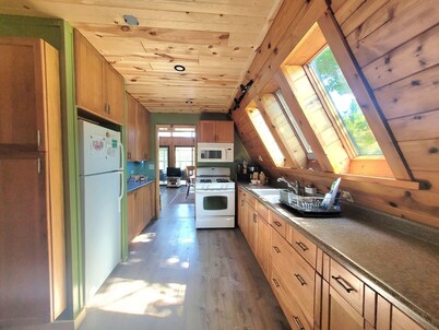 A Frame cabin with a short stroll to a gorgeous sandy beach!