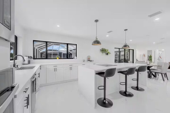 Microwave, oven, stovetop, dishwasher - Waterfront Retreat • Pool • Renovated • 13 Guests (Cape Coral)