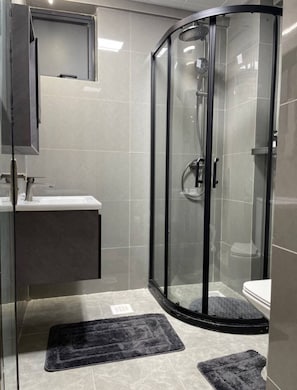 Shower, hair dryer, towels, soap