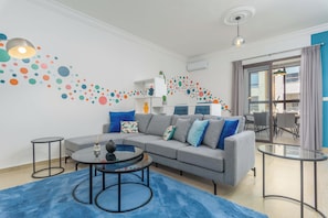 Apartment, 2 Bedrooms, Kitchen, City View | Living room | 50-inch Smart TV with cable channels, streaming services