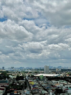 A cityscape with a variety of buildings, including a prominent high-rise. - New Lavida (Ho Chi Minh City)
