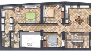 Plan d’étage d’un hôtel comprenant une chambre principale, une chambre secondaire, une kitchenette, une salle à manger, un vestibule, une entrée, une salle de bain et un salon.