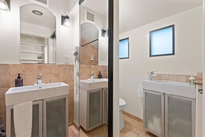 Shower, hair dryer, towels, soap