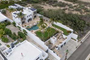 A modern residential building with a swimming pool, solar panels, and a well-maintained garden. - Casa Maravilla - Walk to Beach & Art District. (San José del Cabo)