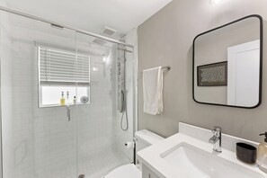 Shower, hair dryer, towels, soap