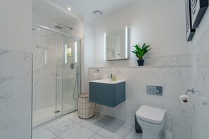 Shower, hair dryer, towels, soap