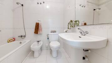 Bidet, towels, toilet paper