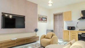 Comfort Apartment, Roll-in Shower, Balcony | Living area | 53-inch Smart TV with digital channels, Netflix, streaming services