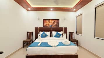 Colchones con pillow-top y caja de seguridad en la habitación