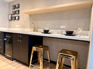 Fridge, stovetop, cookware/dishes/utensils, dining tables
