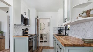 Coffee/tea maker, fridge, microwave, oven - The Coral House — Modern Luxury 1BR with Ocean View Balcony | Cal King Bed + Queen Sleeper, Sleeps 4 · Folding Glass Balcony Doors · Full Kitchen · AC · Two Exclusive Beach Cruisers · Avila Beach · Managed by Solmaré Stays (Avila Beach)