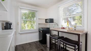 Fridge, microwave, coffee/tea maker, dining tables