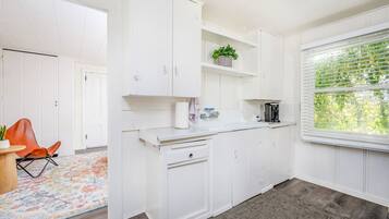 Fridge, microwave, coffee/tea maker, dining tables