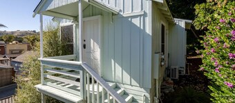 The Pine House — Dog Friendly Studio with Ocean View Deck | Queen Bed Under the Pines · In-Unit Washer & Dryer · AC · Full Kitchenette · Beach Gear & Bikes · Avila Beach · Sleeps 2 · Managed by Solmaré Stays