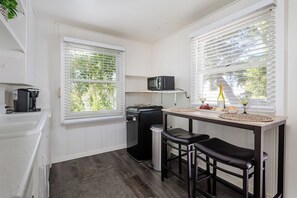 Fridge, microwave, coffee/tea maker, dining tables