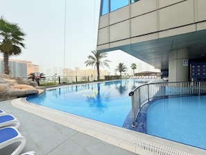 2 outdoor pools, pool umbrellas, pool loungers