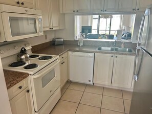 Fridge, microwave, dishwasher, cookware/dishes/utensils