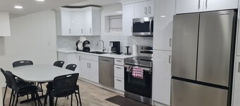 Comfortable 2-Bed Basement Suite | Easy Airport & City Access