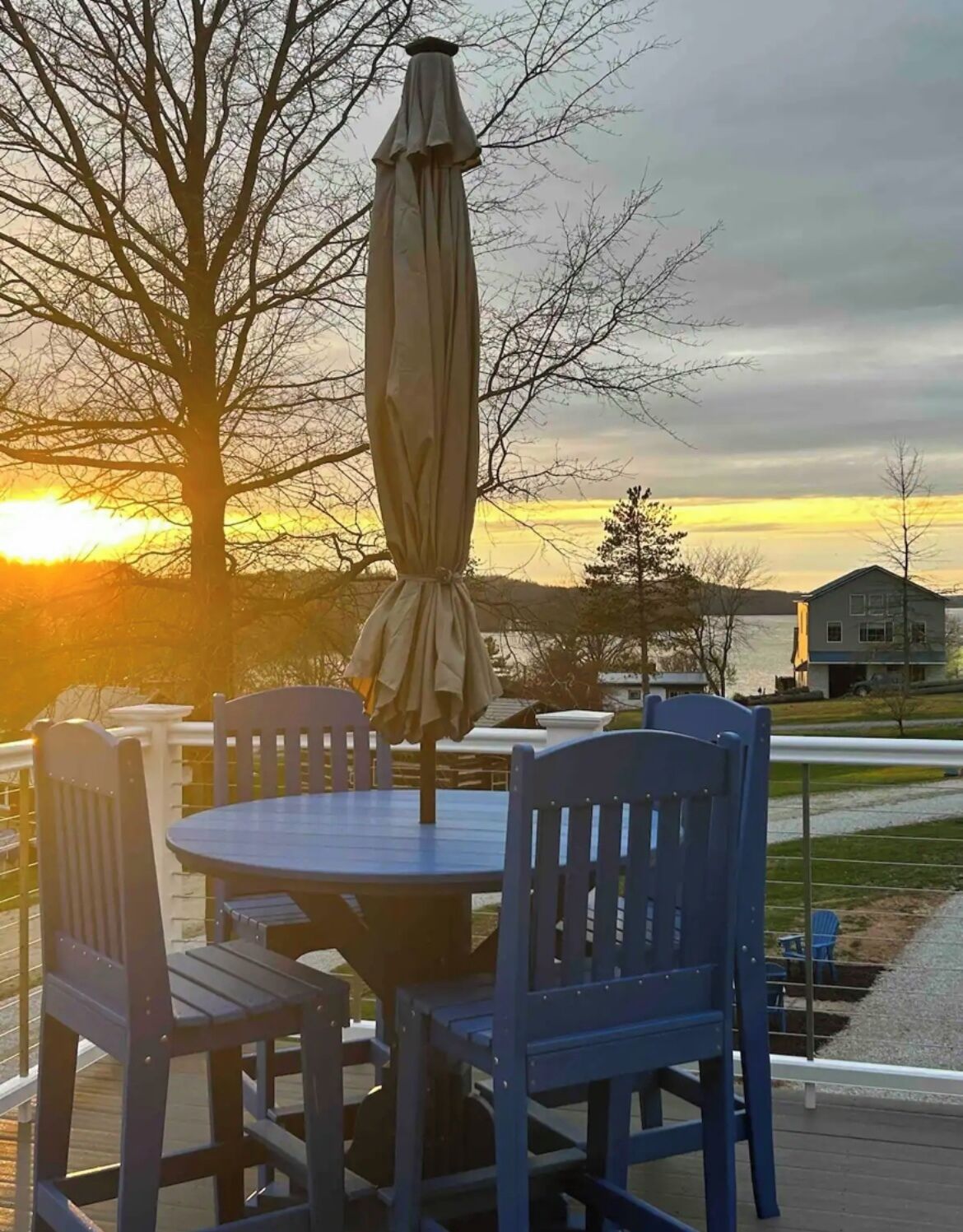 Beautiful sunset lake views from the Polywood  bar table w/ umbrella 
