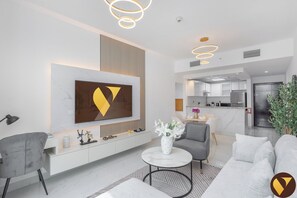 Standard Apartment, Balcony, City View | Living area | 65-inch Smart TV with satellite channels