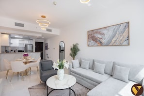 Standard Apartment, Balcony, City View | Living area | 65-inch Smart TV with satellite channels