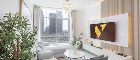 Standard Apartment, Balcony, City View | Living area | 65-inch Smart TV with satellite channels