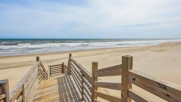 A wooden boardwalk leading to a beach with a clear view of the ocean. - 7BR Walk-to-Beach Corolla Home • Hot Tub • Family-Friendly • Sleeps 16+ (Corrolla)
