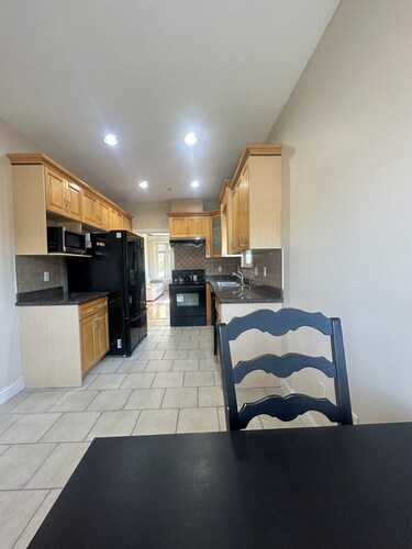 Bright West Side Retreat • 3BR • Kitchen & Living