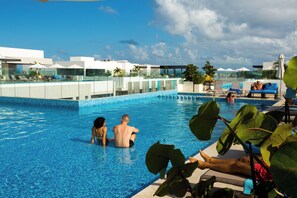 Outdoor pool, open 8:00 AM to 10:00 PM, pool umbrellas, pool loungers