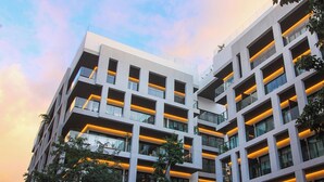 A modern multi-story building with balconies and large windows. - Ipana by The Spot Rentals (Playa del Carmen)