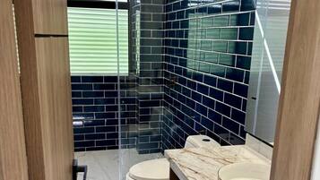 Shower, towels, soap, toilet paper